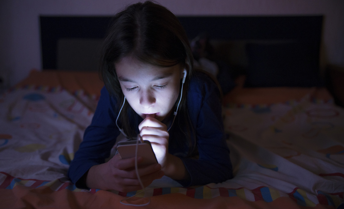 Teenager girl choosing music 