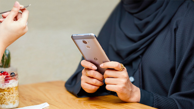 woman holding phone