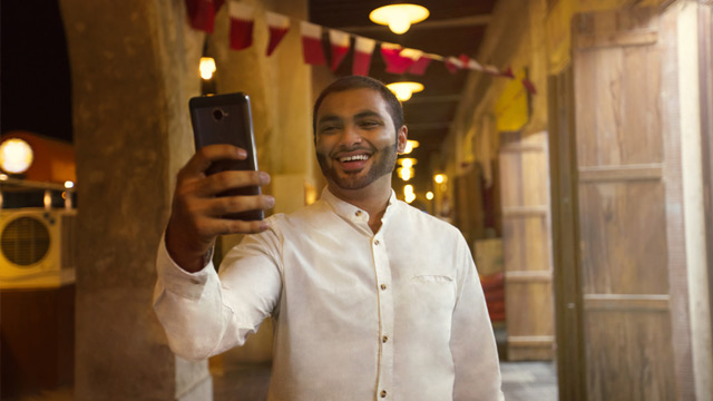 man holding up a phone